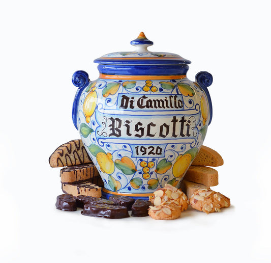 Tuscan Lemon Biscotti Jar – hand-painted Italian majolica cookie jar with golden lemons and blue handles, handmade in Montelupo, Tuscany, filled with DiCamillo biscotti