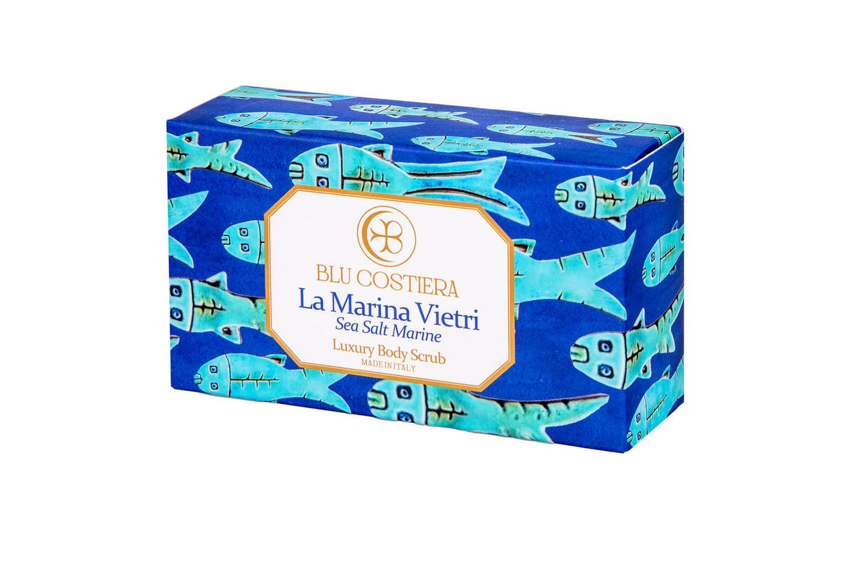 Blu Costiera La Marina Vietri Sea Salt Marine luxury body scrub in its box, angled, wrapped in deep blue paper printed with turquoise hand-drawn fish in the classic Vietri sul Mare motif