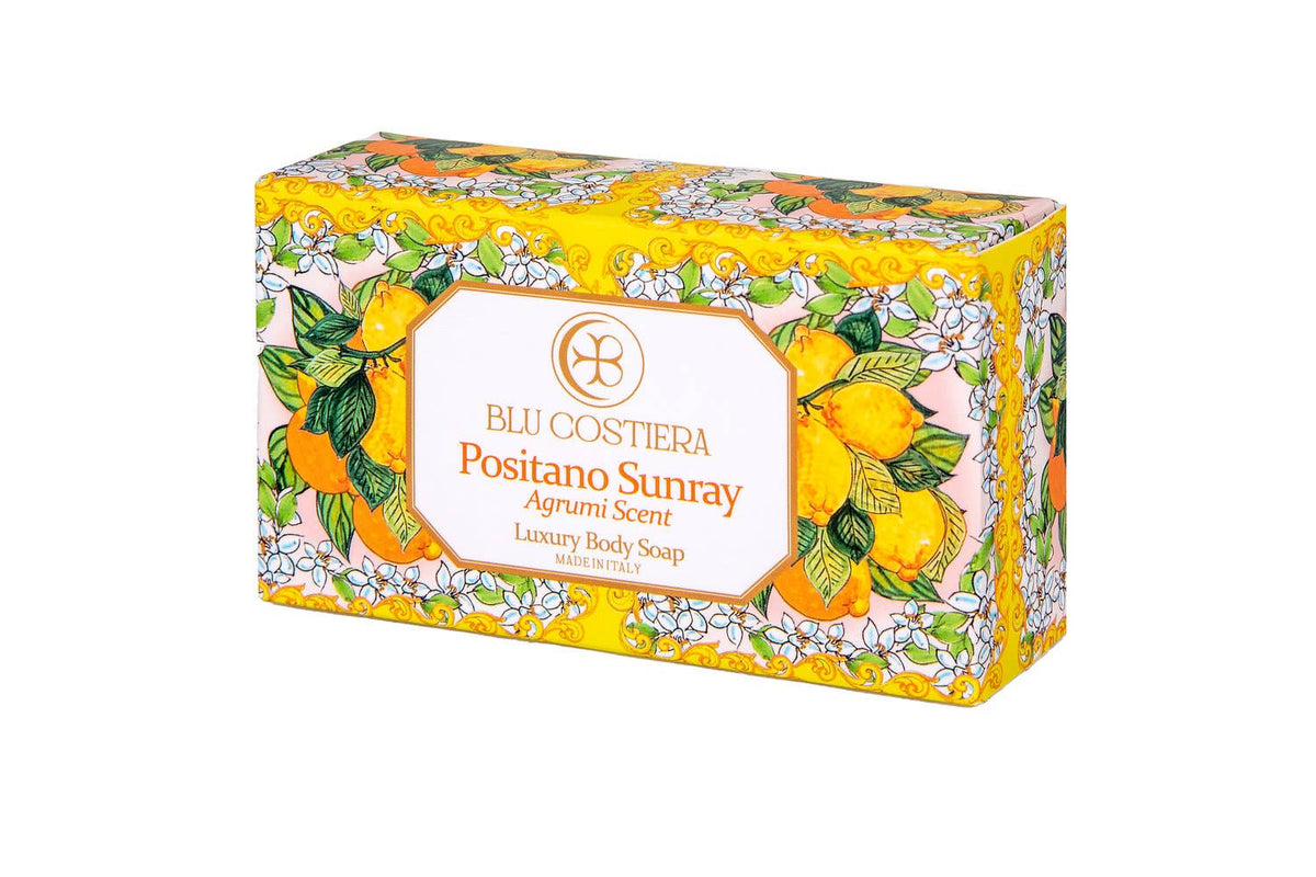 Blu Costiera Positano Sunray body soap in its box, angled, printed with Amalfi maiolica lemons, oranges and orange blossom on yellow, labelled Agrumi Scent Luxury Body Soap Made in Italy