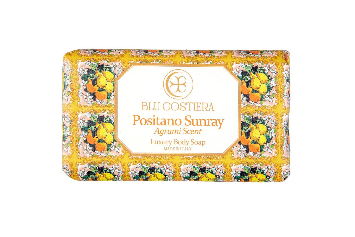 Blu Costiera Positano Sunray Agrumi Scent luxury body soap, front of the wrapped bar, showing hand-drawn lemons, oranges and white blossom on a gold and pink maiolica border