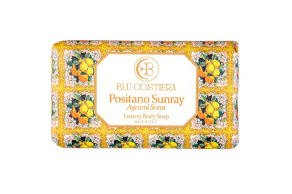 Blu Costiera Positano Sunray Agrumi Scent luxury body soap, front of the wrapped bar, showing hand-drawn lemons, oranges and white blossom on a gold and pink maiolica border
