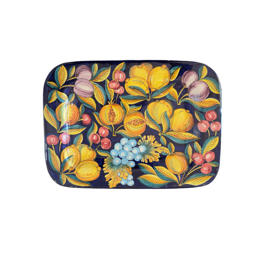 Large Italian hand-painted ceramic wall plate by Francesca Niccacci featuring citrus fruit, berries, and grape motifs on deep blue background