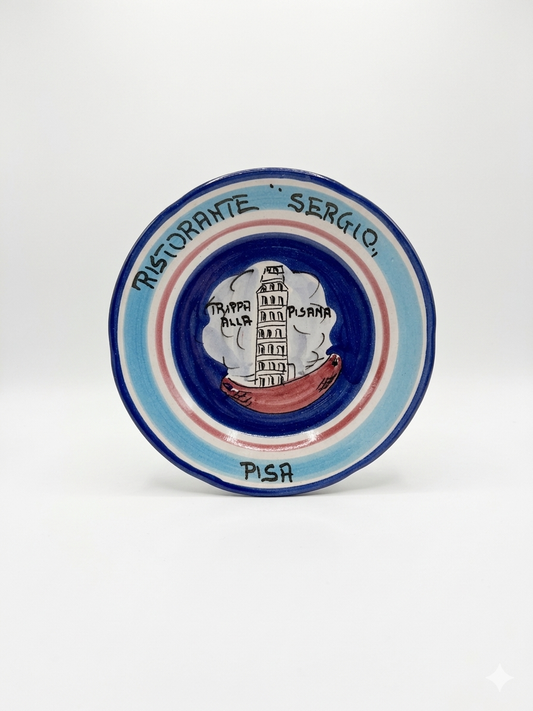 Hand-painted Buon Ricordo ceramic plate with Leaning Tower of Pisa and “Trippa alla Pisana” inscription, blue border design