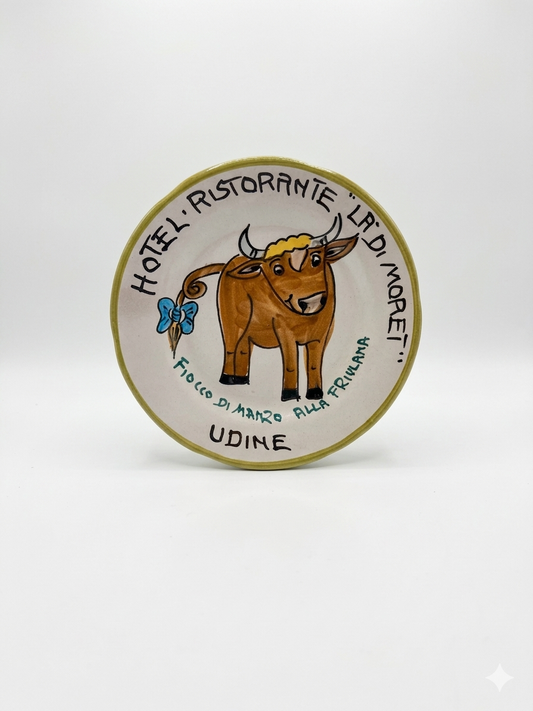 Round ceramic plate with a bull illustration and text on a white background