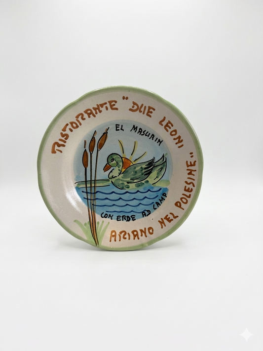 Hand-painted Buon Ricordo Italian ceramic plate with duck, reeds, and water scene from Ariano nel Polesine restaurant Due Leoni