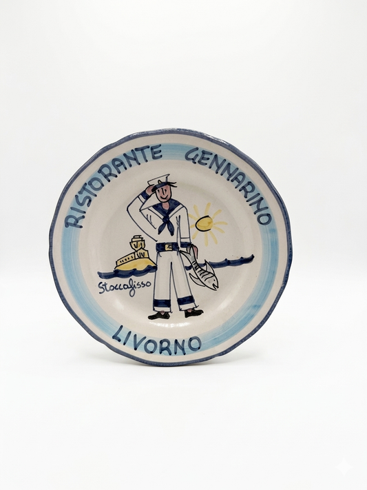 Hand-painted Buon Ricordo ceramic plate with sailor holding fish, Ristorante Gennarino Livorno inscription, blue coastal design