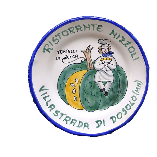 Hand-painted Buon Ricordo Italian ceramic plate from Villastrada with cook seated on a pumpkin, Ristorante Nizzoli tortelli di zucca