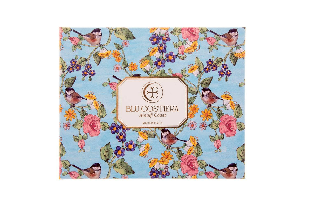 Giardini Mediterranei body scrub gift box from Blu Costiera, closed, printed with songbirds, roses, berries and wildflowers on pale blue