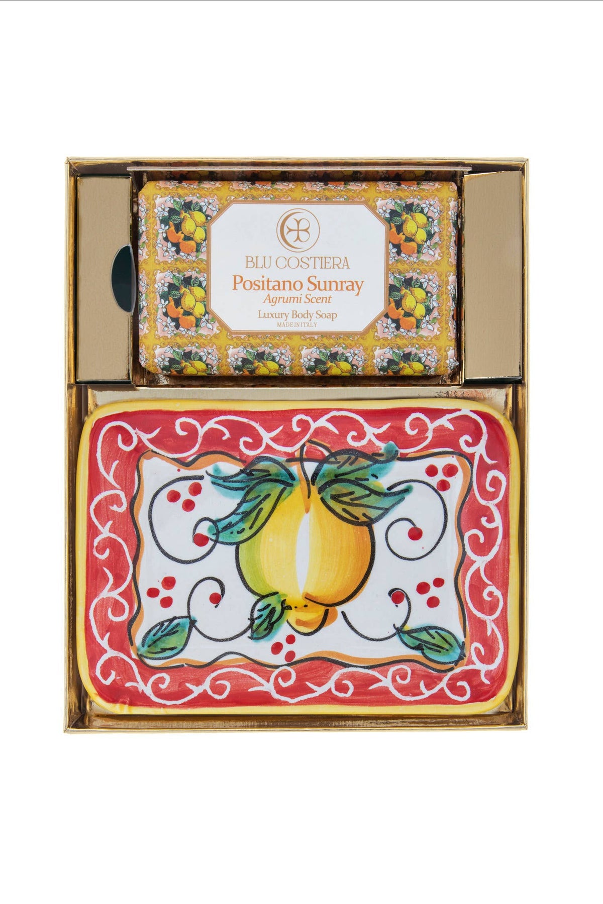 Positano Sunray gift box open from above: a boxed Blu Costiera body soap beside a rectangular hand-painted Vietri ceramic soap dish with a yellow lemon on white and a red border with white scrollwork
